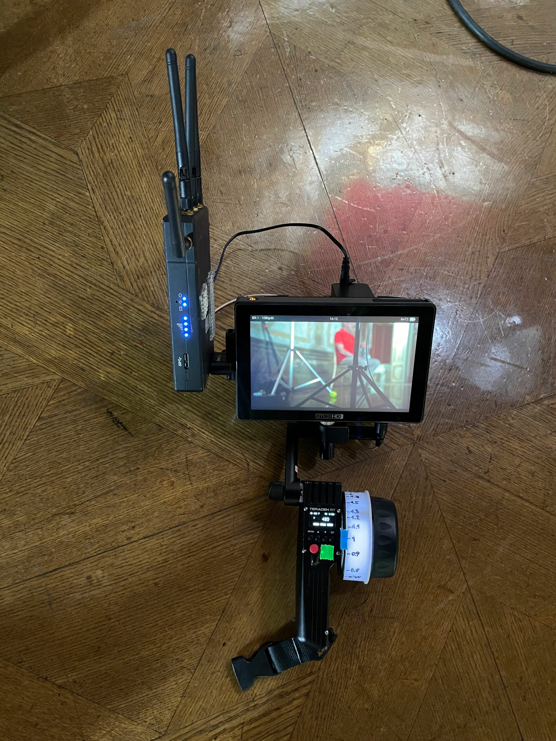 SmallHD 702 touch monitor with a Teradek wireless receiver attached to a Teradek RT wireless focus system hand unit