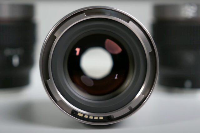 The front of the lenses features an accessory mount with electronic pins