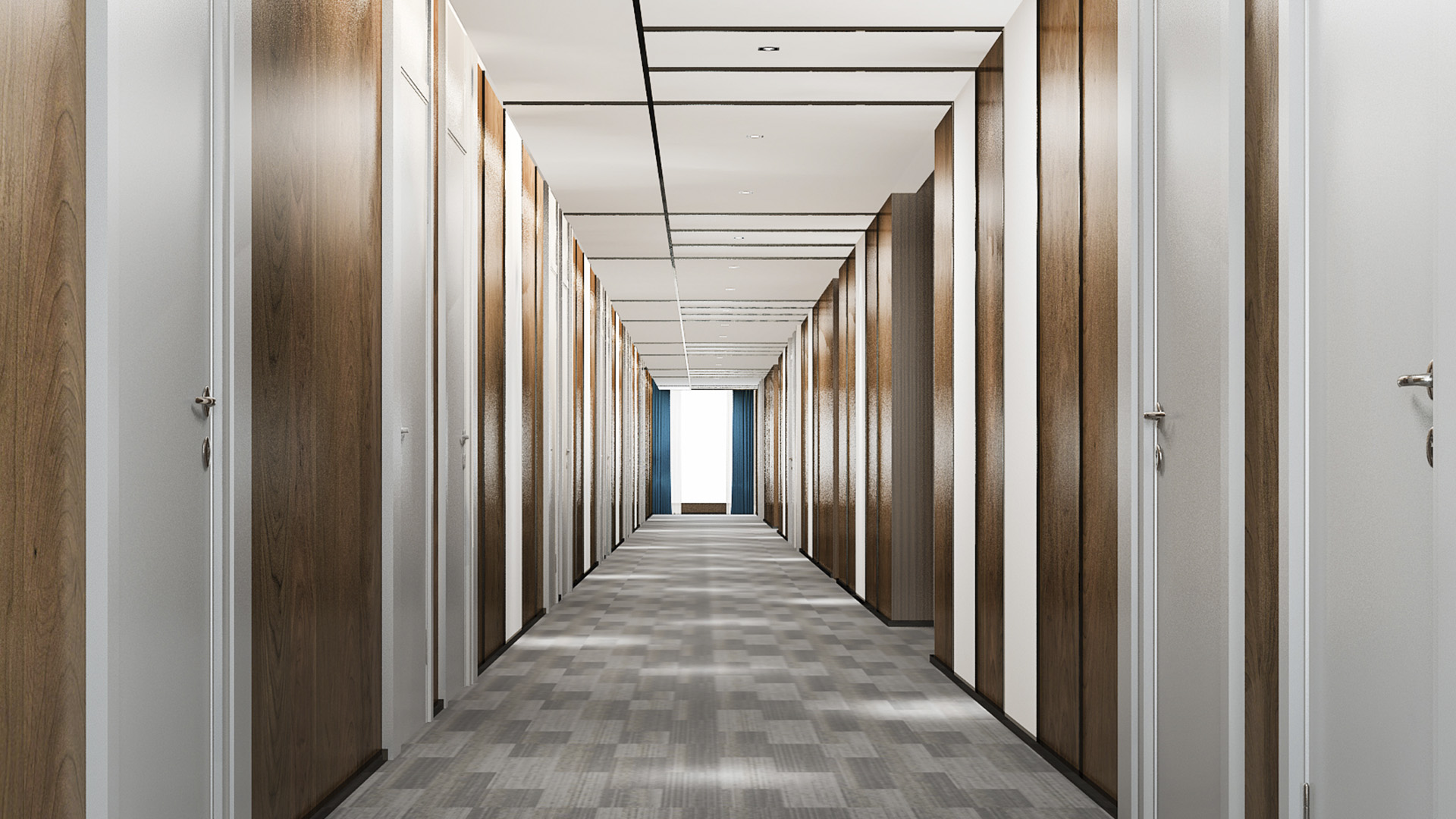 A picture of a long empty corridor leading towards the door
