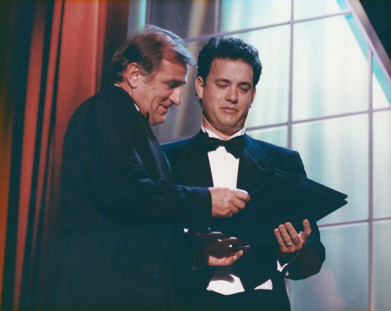 Actor Tom Hanks presenting Otto Nemenz with his Academy Award in 1992. Part of the Otto Nemenz obiturary on CineD