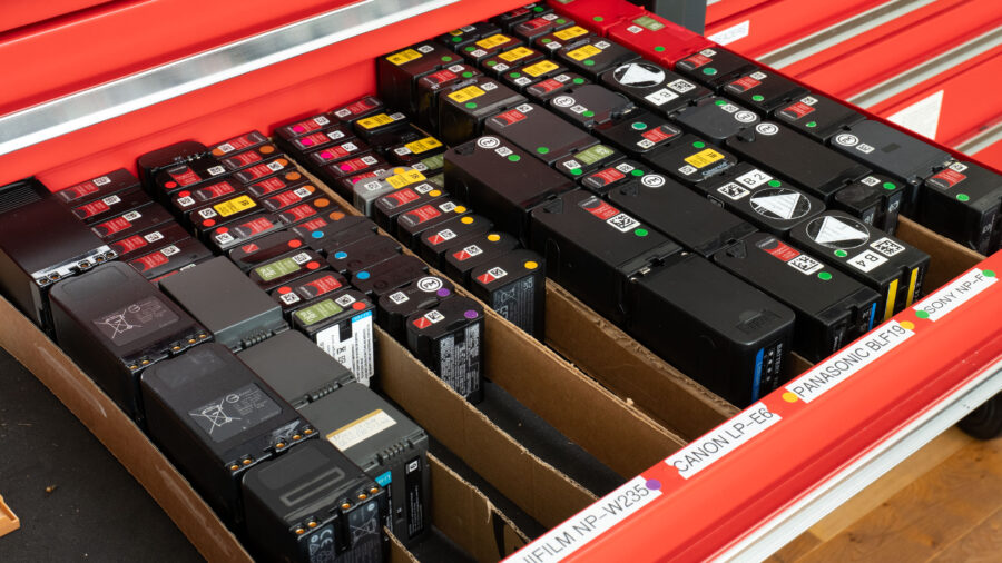 drawer full of different camera batteries