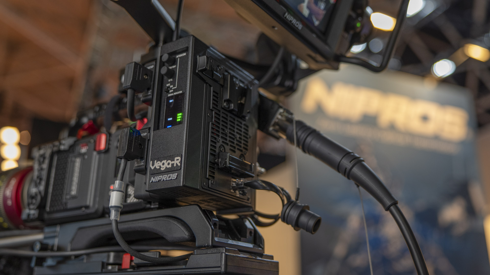 NIPROS VEGA-R V-mount fiber adapter bolted to a RED KOMODO / KOMODO-X