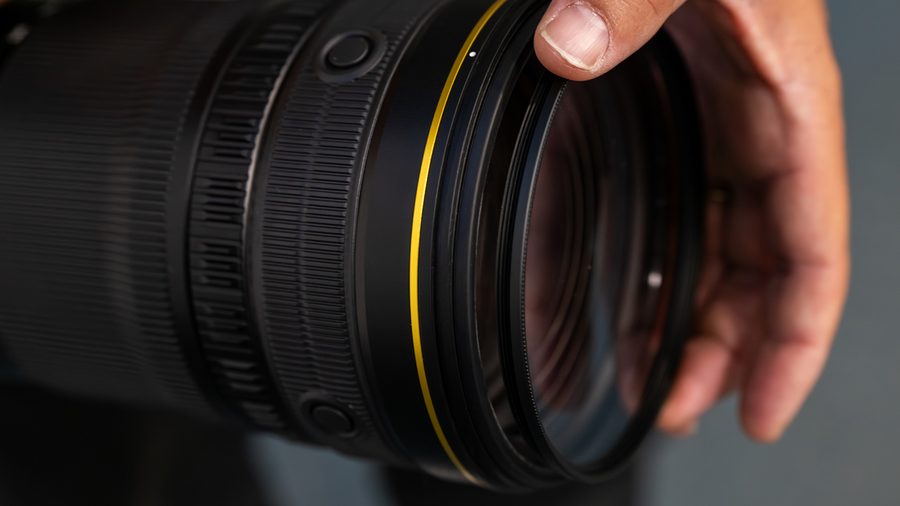 NIKKOR Z 120-300mm f/2.8 TC VR S side view with hand